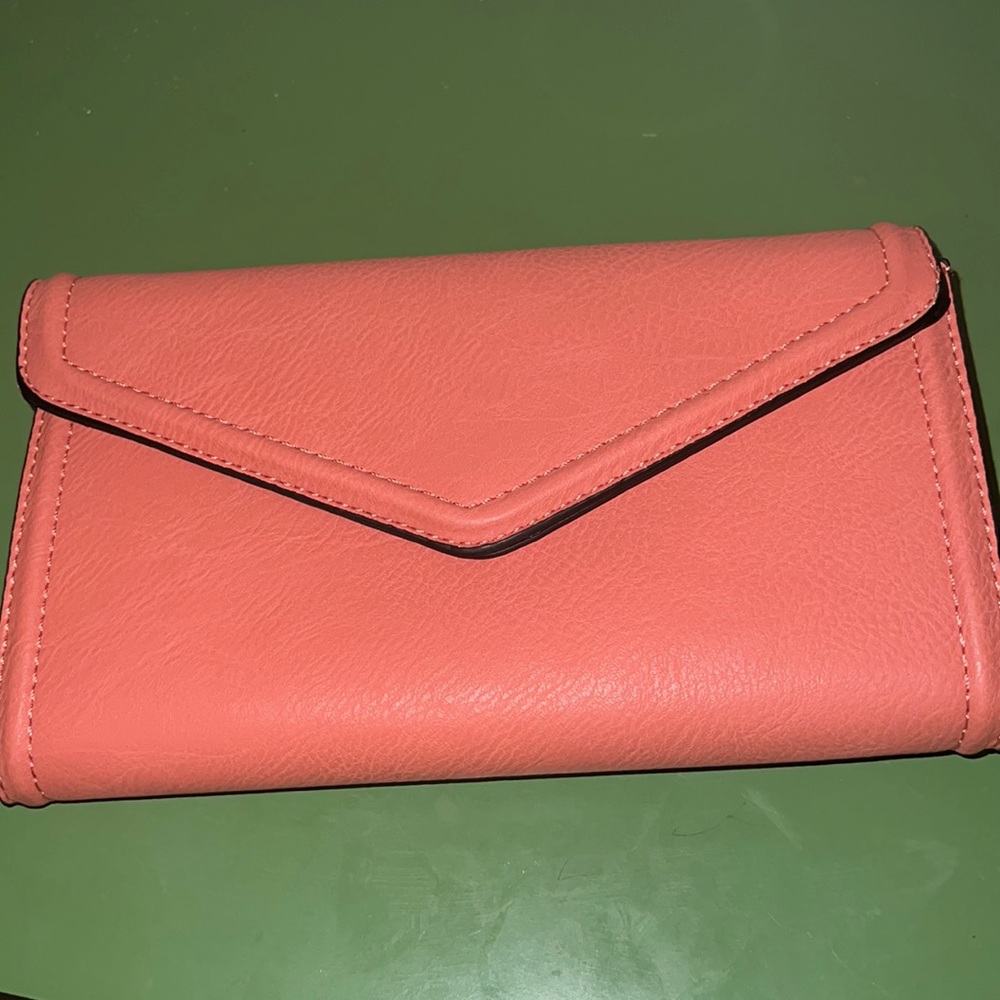 Peach clutch with long woven strap